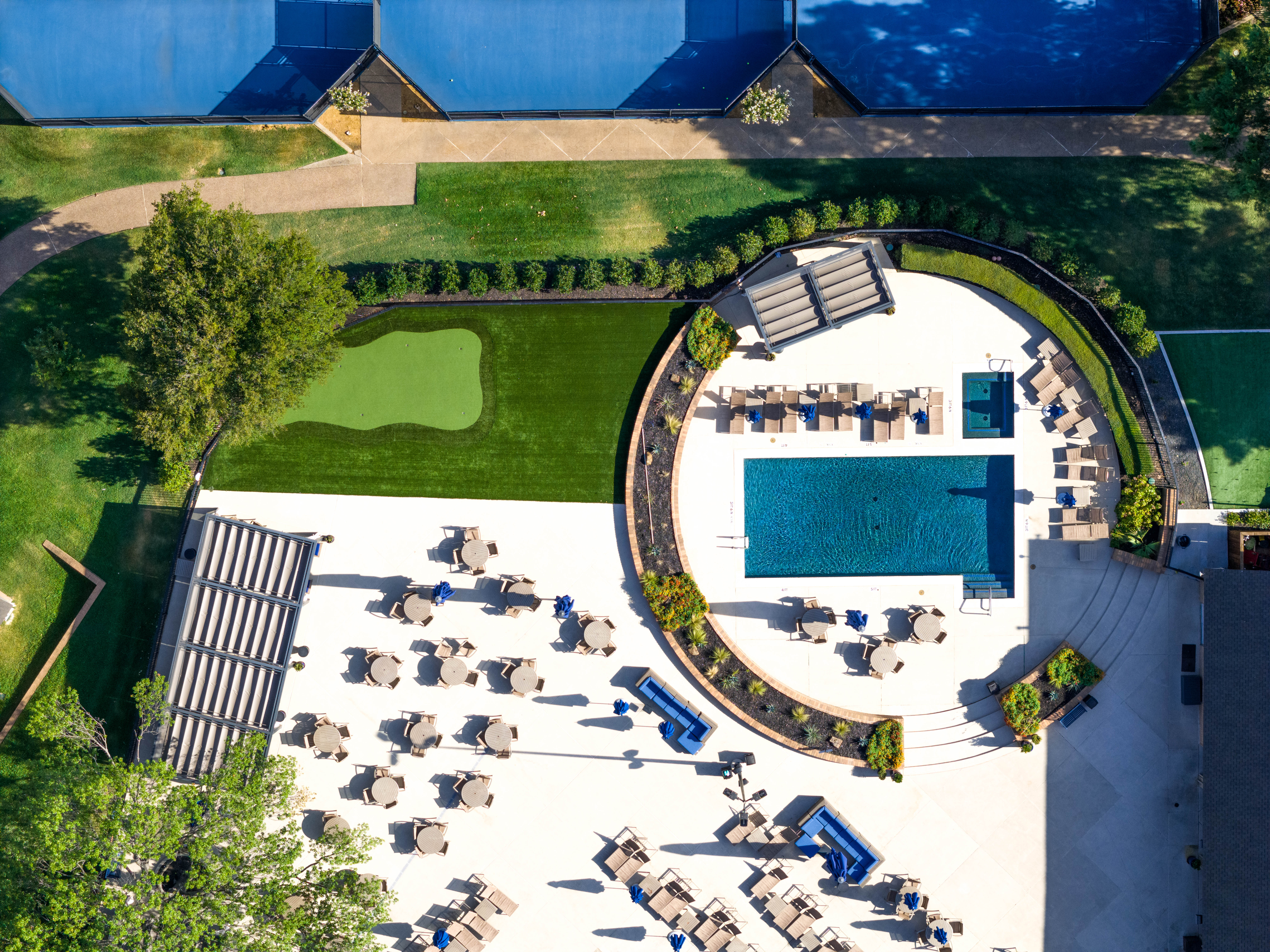 putting green by pool Gleneagles CC Dallas