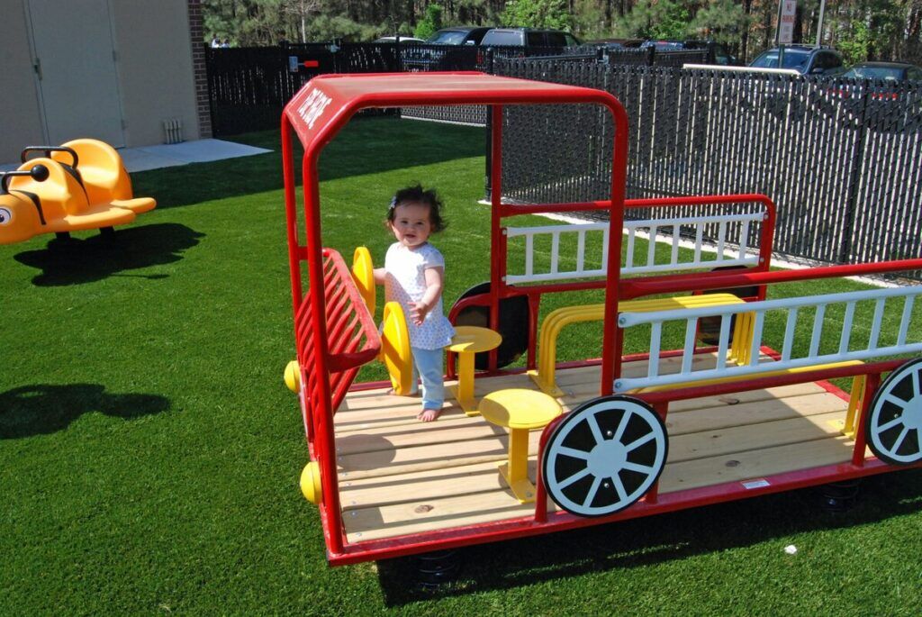 synthetic grass commercial playground truck